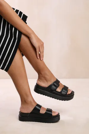 ASHLEY DOUBLE STRAP SANDALS WITH BUCKLE DETAIL IN BLACK FAUX LEATHER