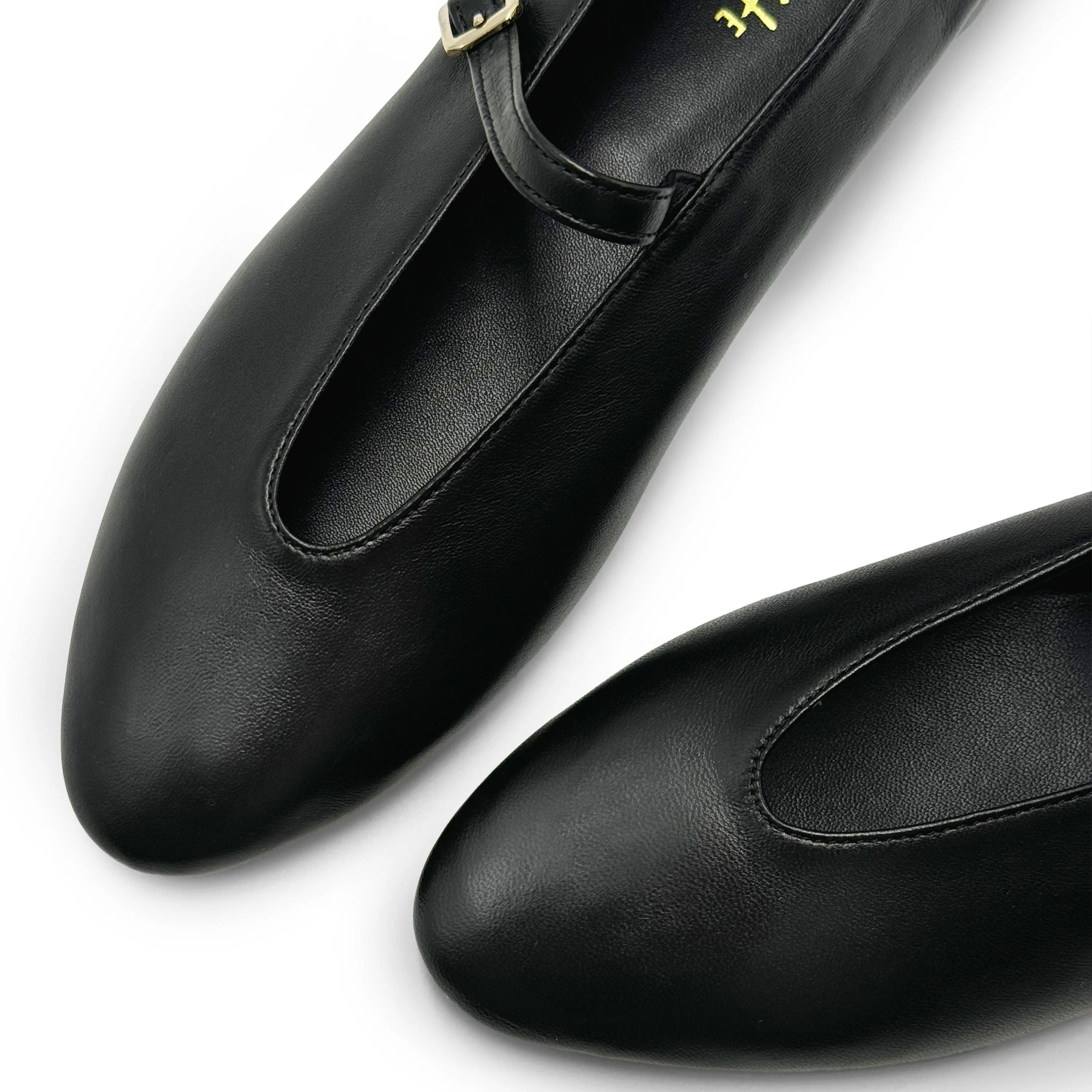 Black leather ballet flats with V-cut and strap
